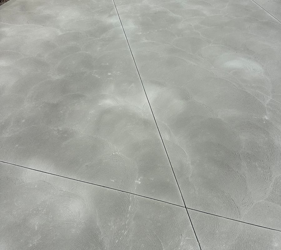 Concrete patio shown as general surface inspiration, not a completed PB11 project